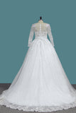 2024 une ligne manches longues robes de mariage en tulle avec appliques et ceinture