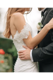 Robe de mariée sirène en dentelle avec décolleté épaule et traîne chapelle